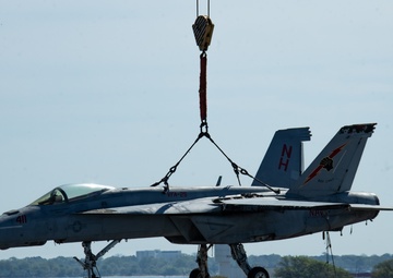 Training Aircraft Lifted Via Crane Aboard Ford