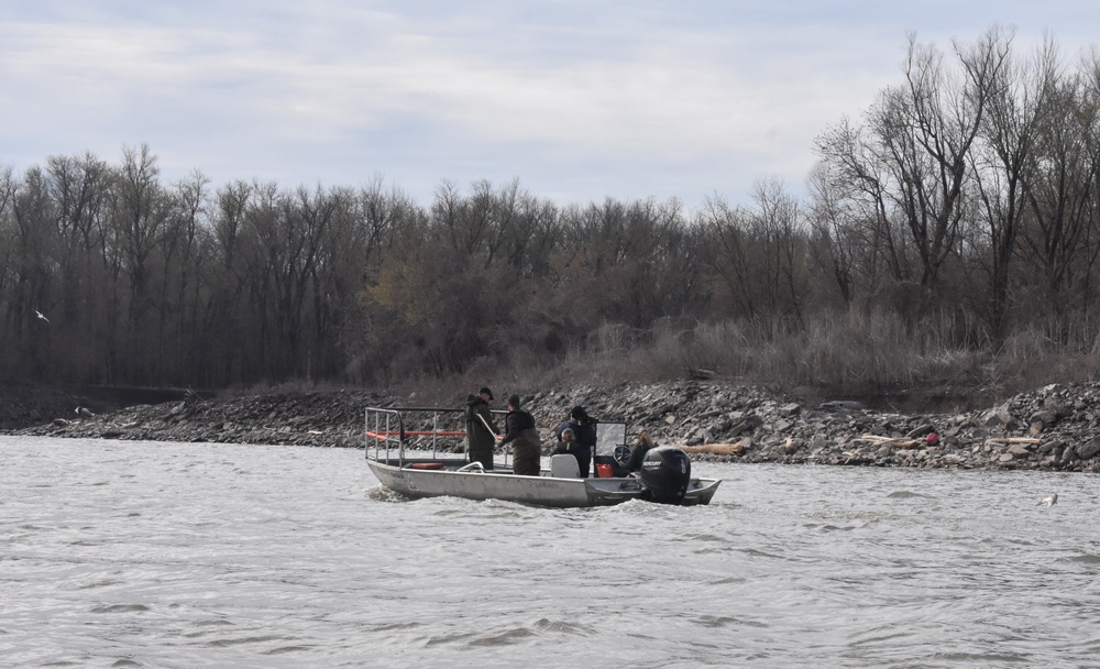 Fisheries monitoring team on the Mississippi River by the Melvin Price Locks and Dam.