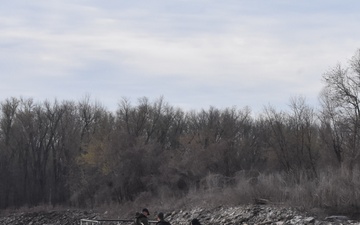 Fisheries monitoring team on the Mississippi River by the Melvin Price Locks and Dam.