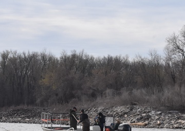 Fisheries monitoring team on the Mississippi River by the Melvin Price Locks and Dam.