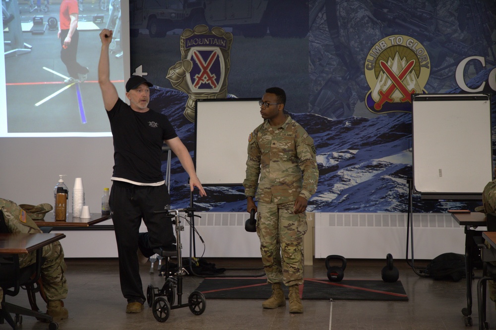 Headquarters and Headquarters Battalion Soldiers   participate in Holistic Health and Fitness training