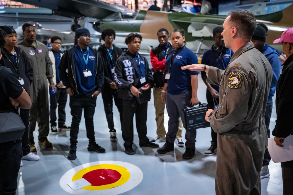 Photo of 116th Air Control Wing members working with Atlanta students in flight simulation, aerospace operations, and drone operation competition events.