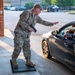 Photo of 116th Air Control Wing leadership greeting Team Robins members entering base during unit training assembly.