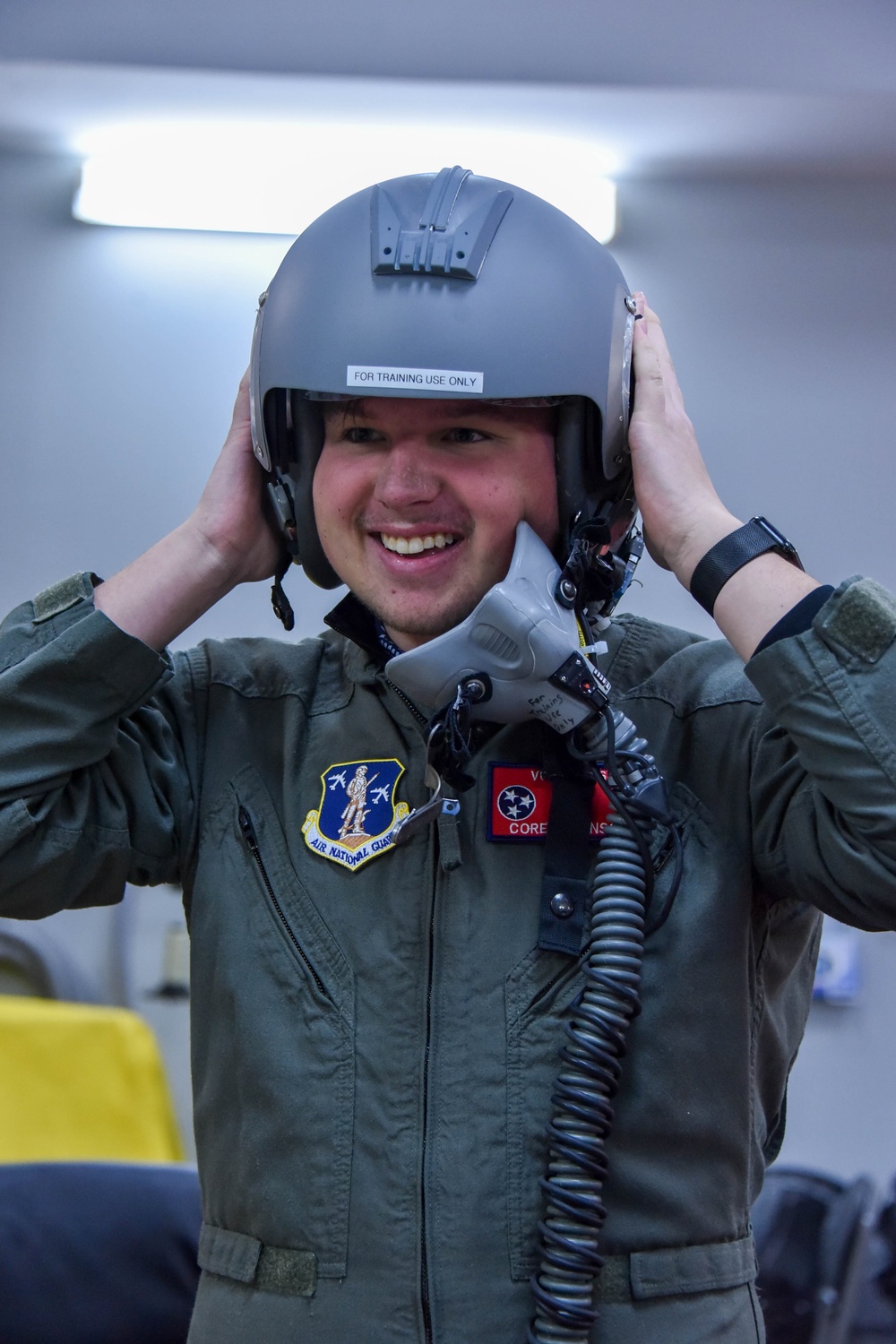 Pilot for a day Corey Johnson, Jr, tries on a flight helmet
