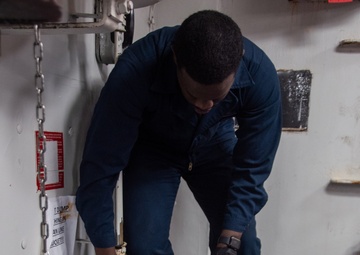 USS Ronald Reagan (CVN 76) Sailors preform maintenance on ship systems