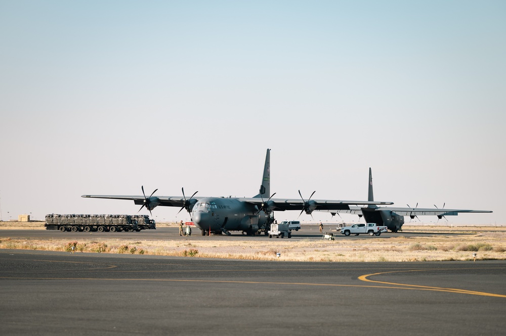 Airmen load AFCENT C-130s with humanitarian aid bound for Gaza