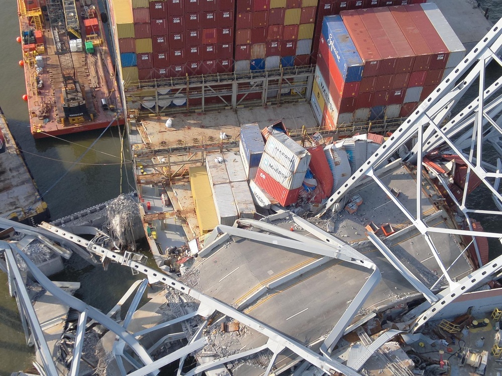 Responders continue to remove containers from the M/V Dali