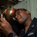Electrician’s Mate conducts maintenance on a catapult rotary panel