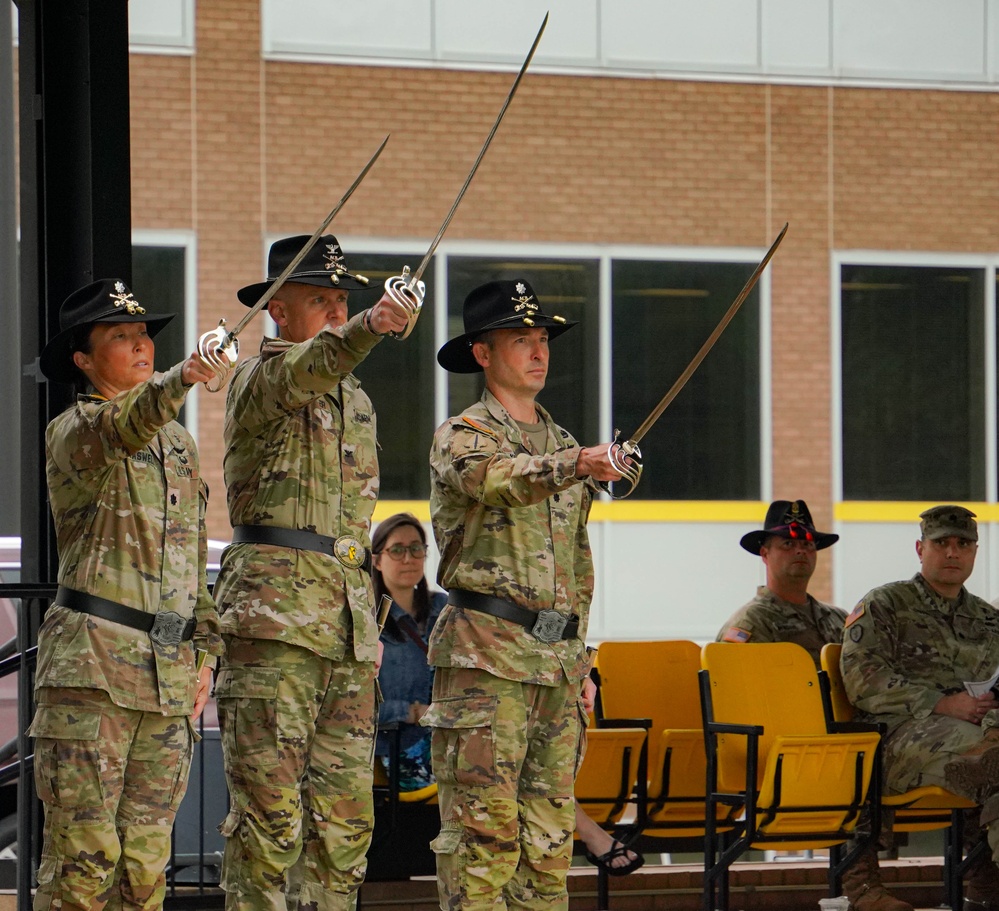 1st Cavalry Aviation Leaders Raise Sabers in Salute during Battalion Change of Command Ceremony