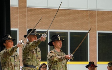 1st Cavalry Aviation Leaders Raise Sabers in Salute during Battalion Change of Command Ceremony