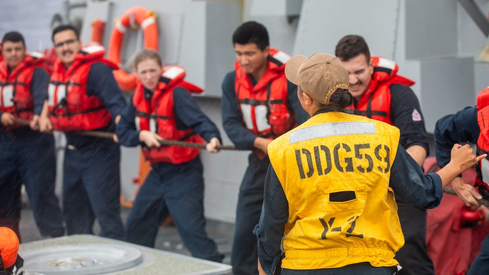 USS Russell (DDG 59) fueling-at-sea with USS Theodore Roosevelt (CVN 71)