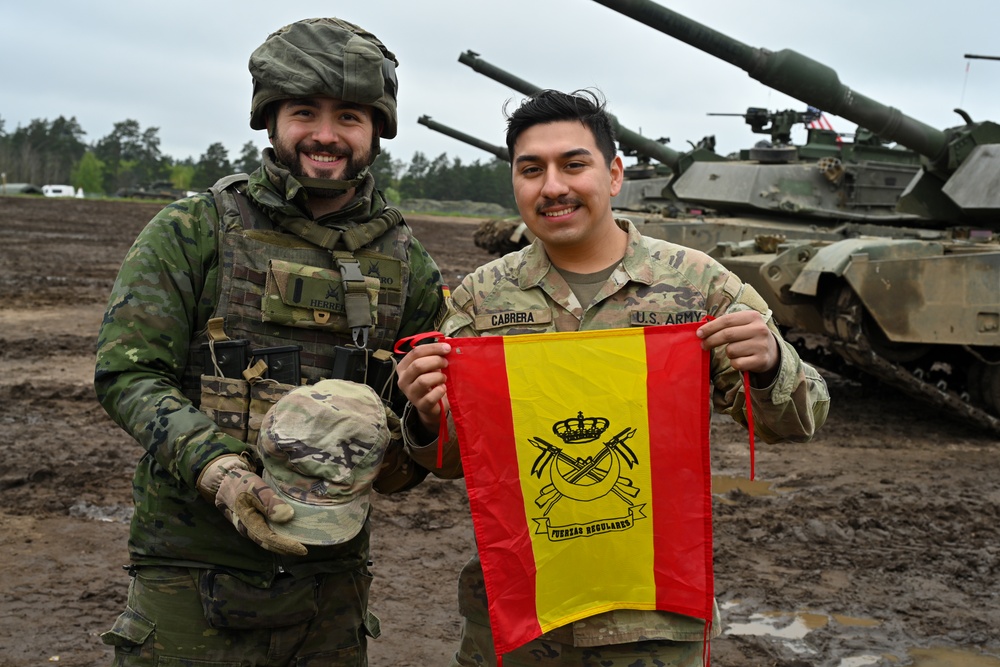 Saber Strike 24: U.S. Soldiers and Spanish Armed Forces Soldiers exchange items
