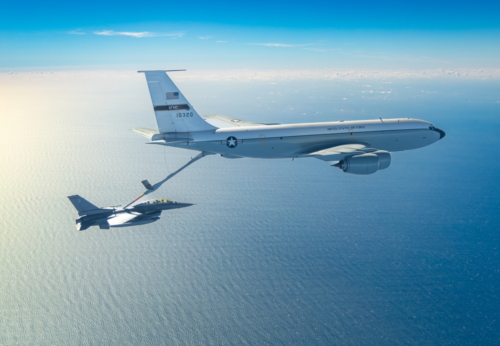 AFMC KC-135 tanker refuels an F-16D over the Pacific Ocean