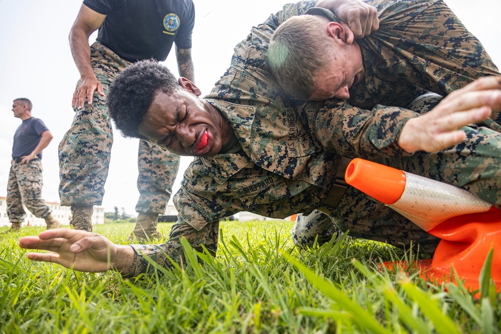 Marines endure OC spray training during MAI course