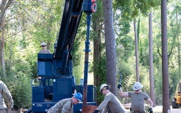 Photo of U.S. Airmen Constructing Obstacle Course at Perry High School