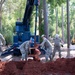 Photo of U.S. Airmen Constructing Obstacle Course at Perry High School