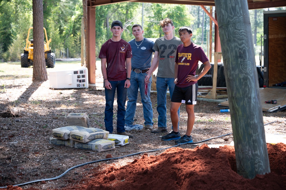 Photo of U.S. Airmen Constructing Obstacle Course at Perry High School