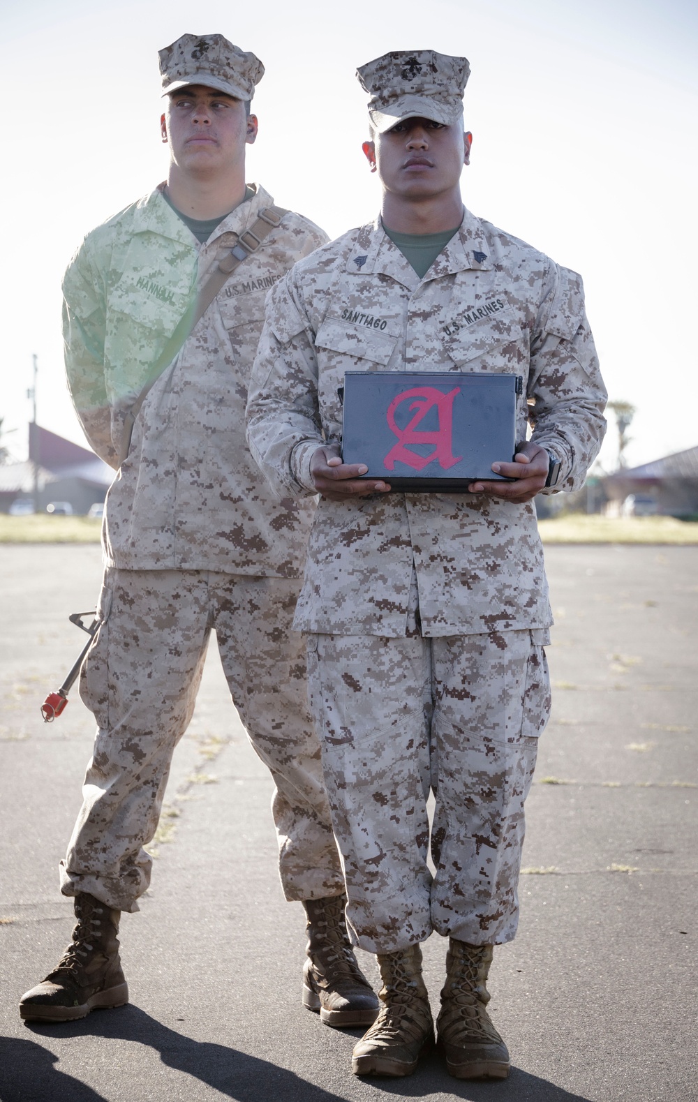 Marines with Alpha Company receive their Eagle, Globe and Anchors