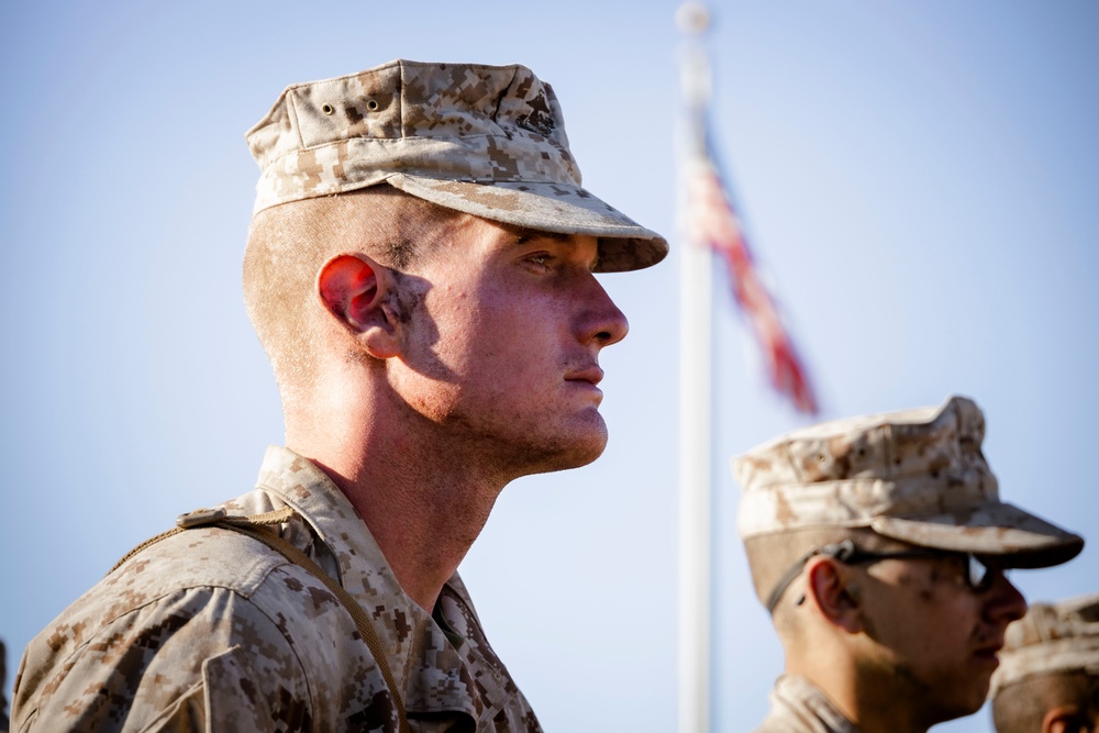 Marines with Alpha Company receive their Eagle, Globe and Anchors