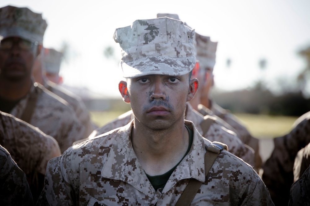Marines with Alpha Company receive their Eagle, Globe and Anchors