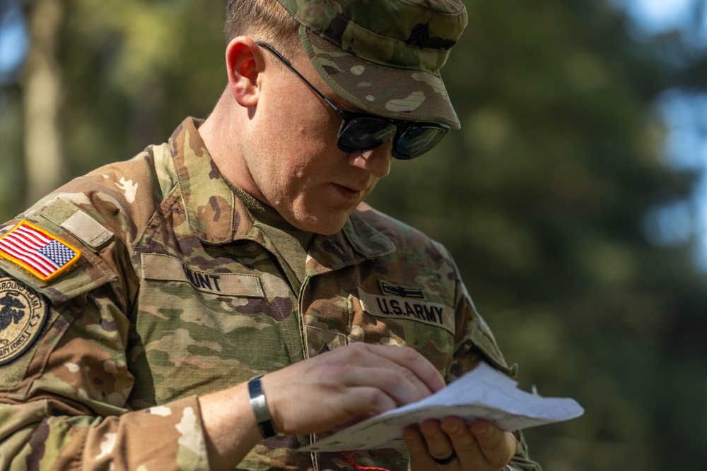 Sgt. Thomas Hunt checks his map