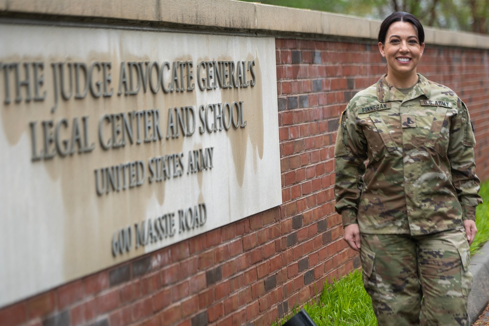 Photo By Billie Suttles | 223rd Officer Basic Course student 1st Lt. Kimberly Finnegan is pictured in front of The Judge Advocate General's Legal Center and School.