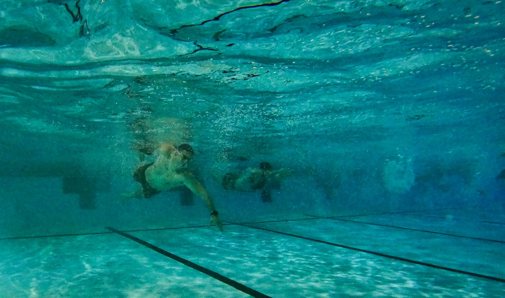 U.S. Marines compete in a swimming event during the 2024 fittest instructor event