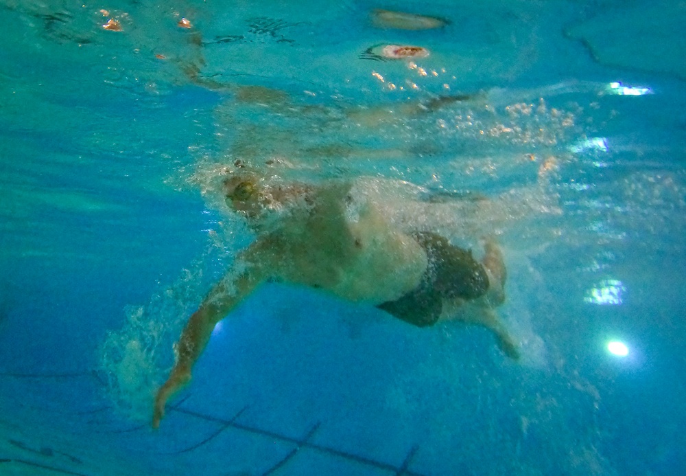 U.S. Marines compete in a swimming event during the 2024 fittest instructor event