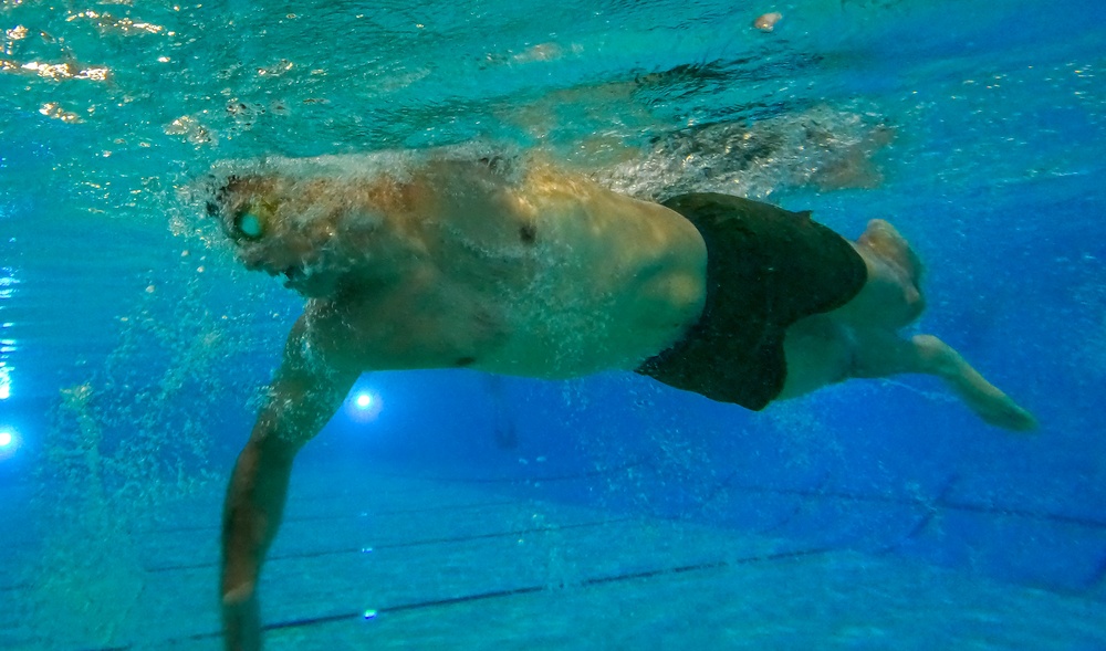 U.S. Marines compete in a swimming event during the 2024 fittest instructor event