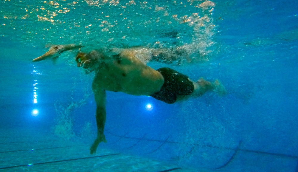 U.S. Marines compete in a swimming event during the 2024 fittest instructor event