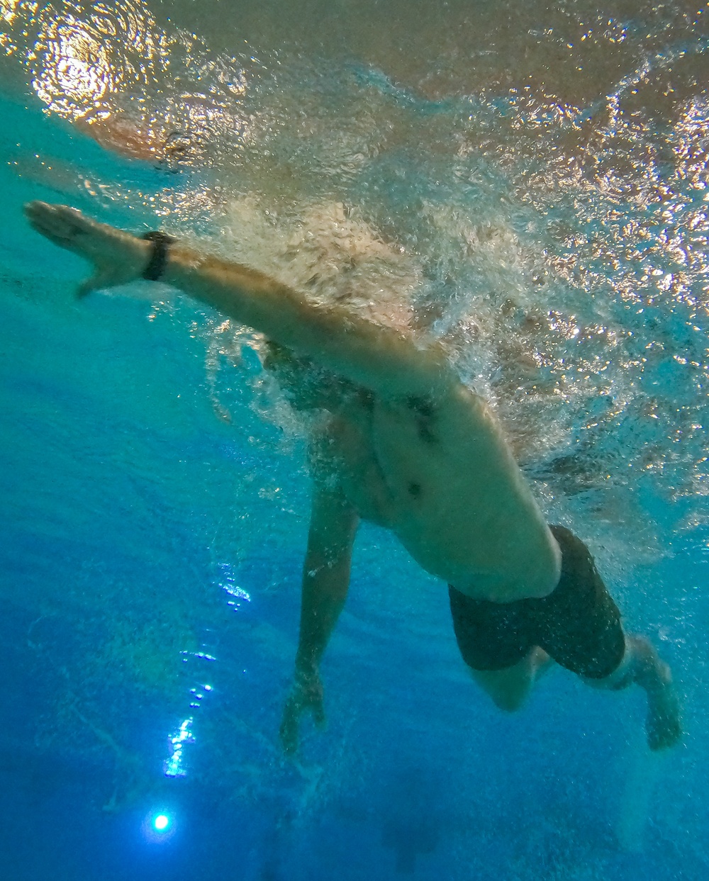 U.S. Marines compete in a swimming event during the 2024 fittest instructor event