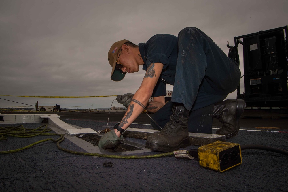USS Carl Vinson (CVN 70) Sailor Installs Safety Wire