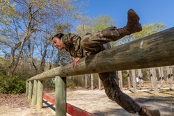 1st Lt. Jessica Romero hurdles over an obstacle [Image 1 of 7]