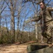 Staff Sgt. Zachary Mills balances on an obstacle