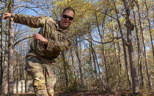 Staff Sgt. Gavin Hopler balances on an obstacle
