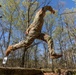 Sgt. Thomas Hunt jumps over a pit