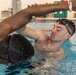 1st Lt. Michael Vigh helps Sgt. Asuerus Thompso work on his swimming form