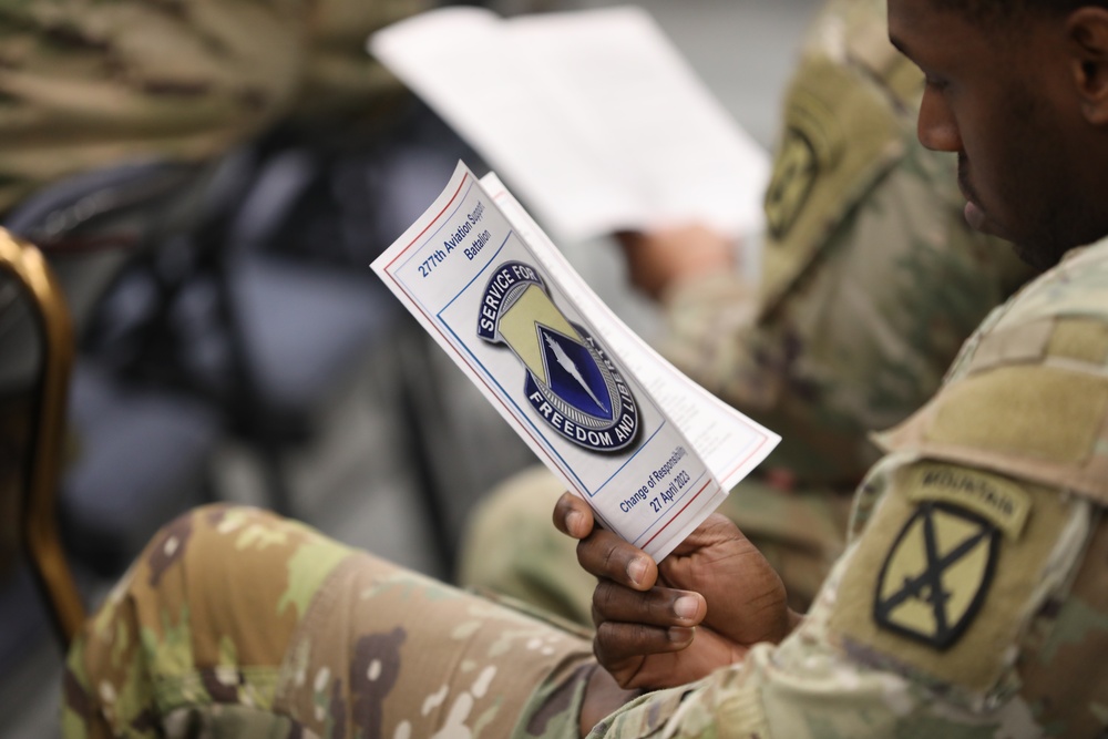 A Soldier reads a pamphlet for a Change of Responsibility