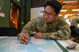 An Intelligence Analyst Draws On A Map Vibrant Response 24