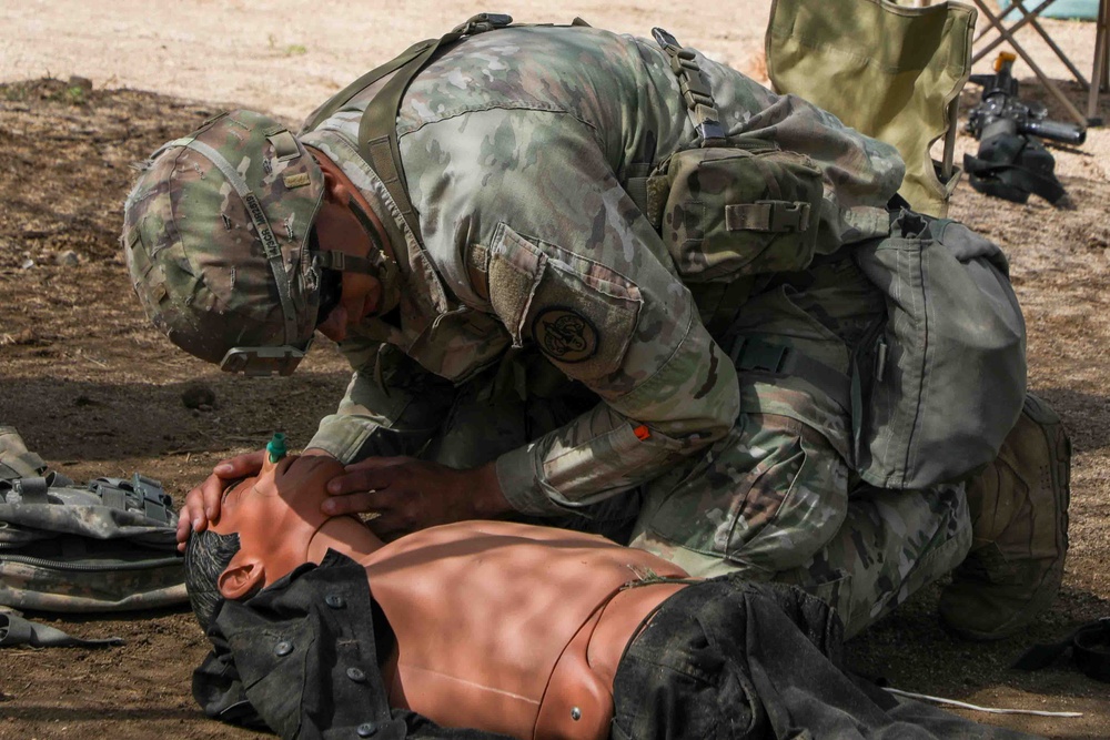 Soldiers train for the Expert Soldier, Infantry, Medical Badge.