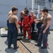 Sailors aboard the USS Howard conduct a sea contamination exercise in the South China Sea