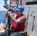 Sailors aboard the USS Howard conduct a replenishment-at-sea with USNS John Ericson in the South China Sea
