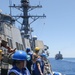 Sailors aboard the USS Howard conduct a replenishment-at-sea with USNS John Ericson in the South China Sea