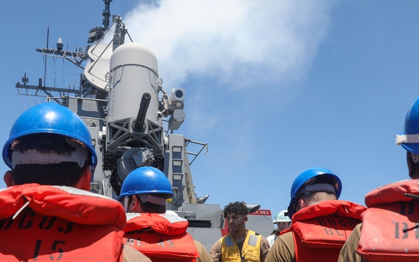 Sailors aboard the USS Howard conduct a replenishment-at-sea with the USNS John Ericson in the South China Sea