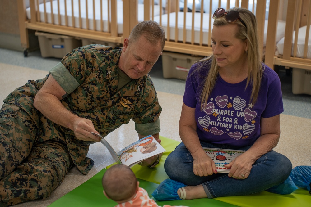 Volunteers read at CDC for the Month of the Military Child