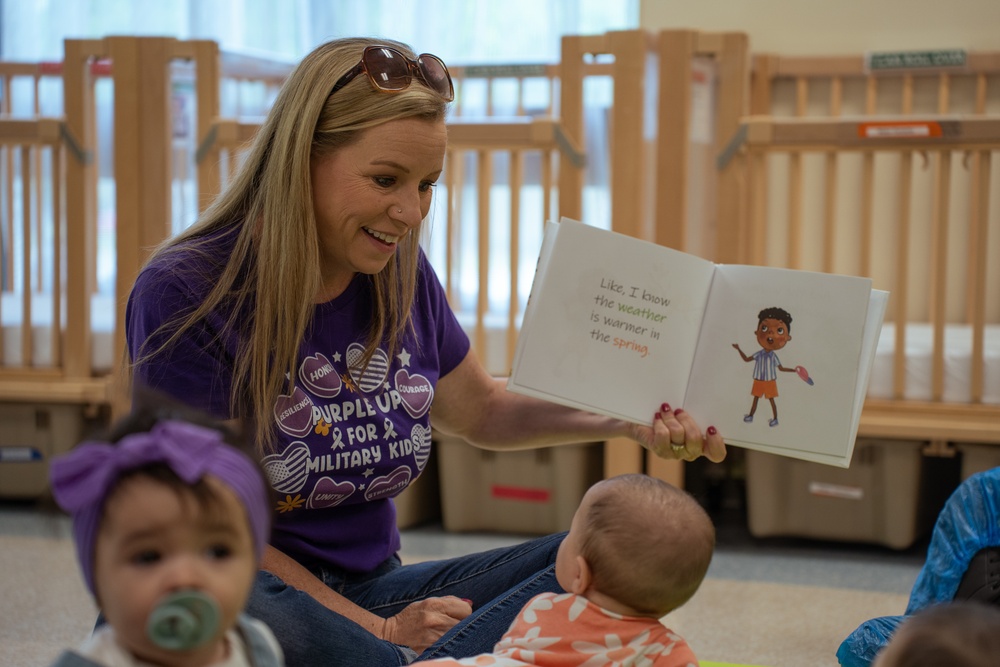 Volunteers read at CDC for the Month of the Military Child