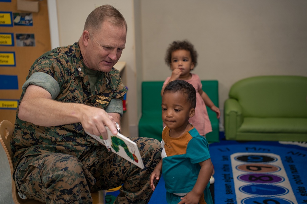 Volunteers read at CDC for the Month of the Military Child