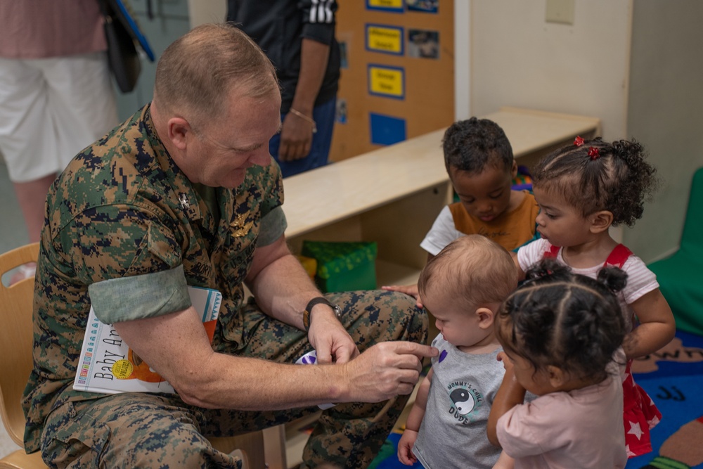 Volunteers read at CDC for the Month of the Military Child