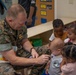 Volunteers read at CDC for the Month of the Military Child