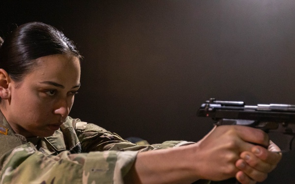 1st Lt. Brainna Mirmina fires a simulation pistol